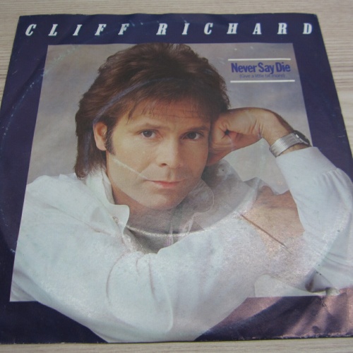 Single  /   Cliff Richard ?– Never Say Die     / DE  PRESS / RAR /