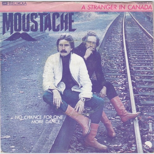 Moustache (5) - A Stranger In Canada (7", Single)